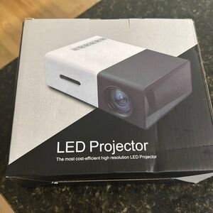 LED PROJECTOR. connect your phone, use with social media. Never opened